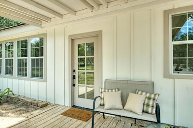 Property entrance featuring board and batten sidi