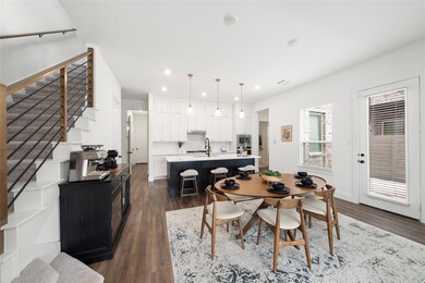 Dining room featuring dark hardwood / wood-style flooring and sink