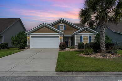 View of front of property featuring a garage and a