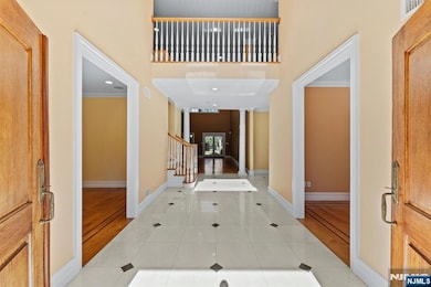 The Sun-Filled Main Level Showcases Open-Concept Living and Dining Areas, Ideal for Entertaining and Everyday Living