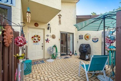 Front door and spacious front patio area