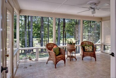 Sunroom overlooks patio (out of sight) to Creek; d
