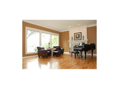 Mantel with attractive white tile is offset by a w