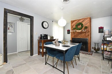 Dining area with fireplace.