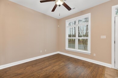 Unfurnished room featuring hardwood / wood-style f