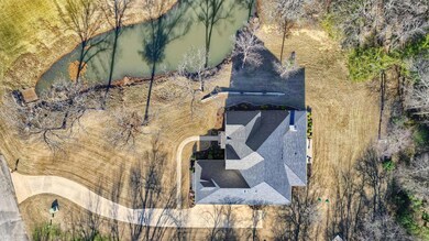 Property line extends through middle of pond.