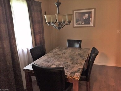 Dining area with new in 2016 laminate wood floorin