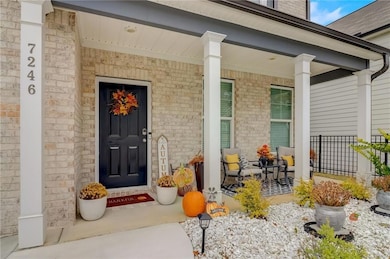Entrance to property with a porch