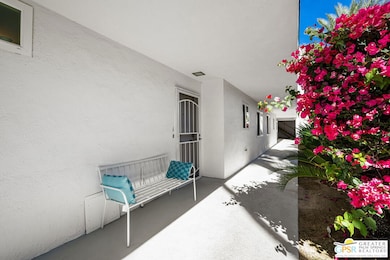 private entry with bougainvillea
