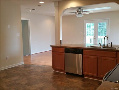 Another view of kitchen where it is open to den.