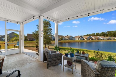View of patio with a water view