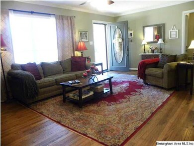 Living room with gleaming hardwoods