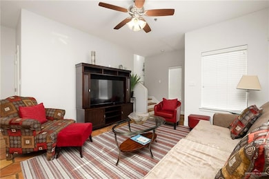 Living room featuring ceiling fan