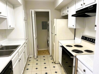 Bright kitchen double sink. electric stove