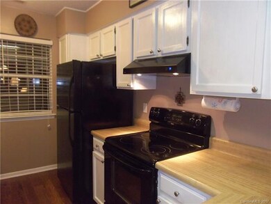 GLEAMING KITCHEN WITH FRESHLY PAINTED WHITE CABINE