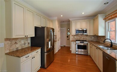 Lovely updated kitchen with granite counters, new backsplash, recent cabinet fronts and drawers. Recent SS appliances include a high end gas range with electric oven.  Refrigerator conveys.