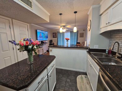 Kitchen featuring tasteful backsplash, sink, dishw