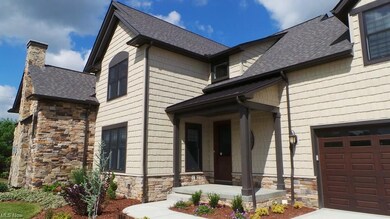 Covered Front Entry and Key Pad Entry to the Garag