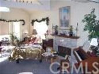 Living room with marble faced fireplace