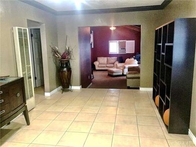 Spacious Living room with beautiful crown molding 