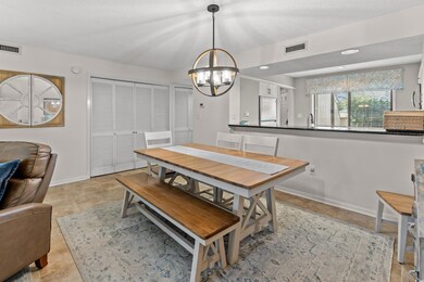 Dining room with a chandelier and baseboards