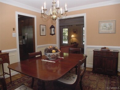 Dining room w/ crown molding, chair rail and pictu