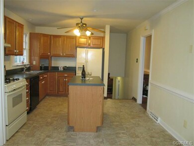Another view of the kitchen showing stairwell lead
