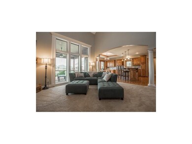 Open concept living room with view of the patio an