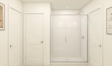 Primary bath with glass shower enclosure