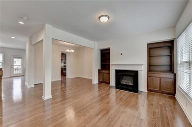 Unfurnished living room with an inviting chandelie
