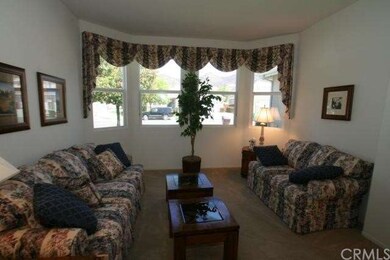 Formal living room with bay windows and mountain v