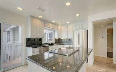 Prime - upper level end unit, no one above, with soaring vaulted ceilings and upgrades galore!