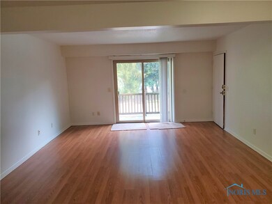 Living Room with sliders leading to a balcony