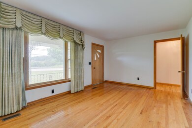 Large picture window and cool vintage front door.