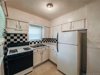 Efficiency kitchen off of formal dining room