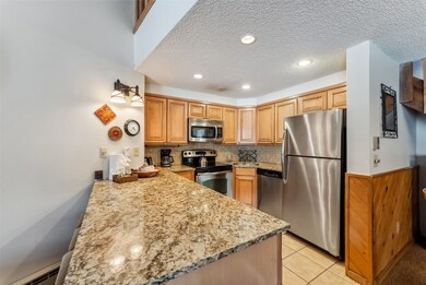 Kitchen featuring appliances with stainless steel