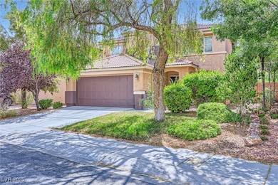 View of front of house featuring stucco siding, a
