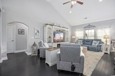 Living room with dark hardwood / wood-style floori