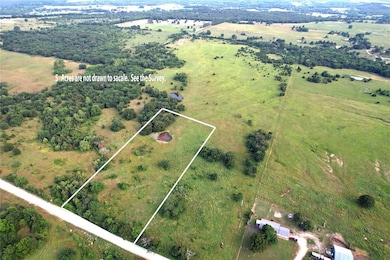 Birds eye view of property with a rural view