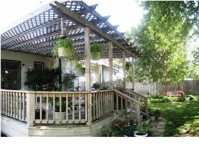 View of the deck and pergola overlooking the backy