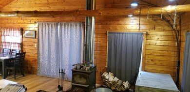 20605 15 mile liv rm with heat stove