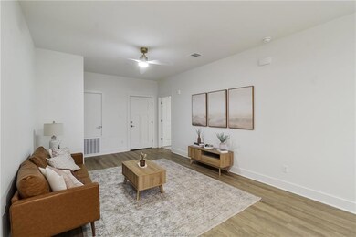 Living room featuring wood finished floors and a c