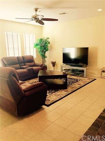 Great room with ceiling fan