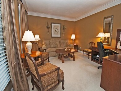 Living room provides seating in an elegant and cla