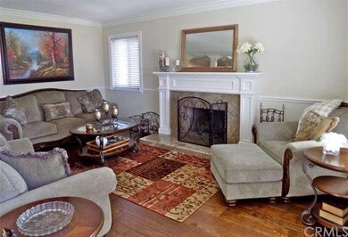Stunning fireplace, chair rail & crown molding in 