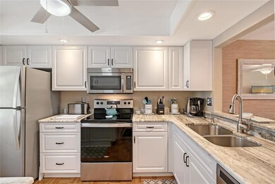 Gorgeous updated Kitchen with granite countertops and pass through counter to dining area!