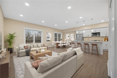 The open-concept main space features a large famil