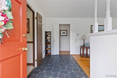 Foyer with dark wood-type flooring