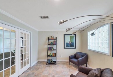 Reading or TV room with double french pocket door.