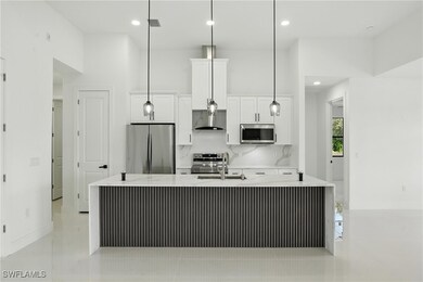 Kitchen with appliances with stainless steel finis